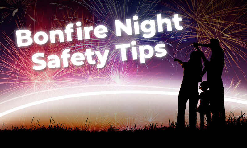 Image of a family in silhouette watching fireworks in the sky with the words "Bonfire Night Safety Tips"