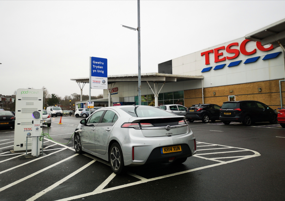 Electric car charging up at Tesco supermarket